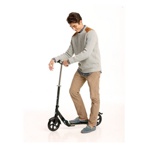 person riding mico flex scooter