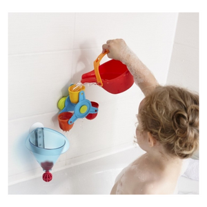 Child playing with Bathing Bliss Water Wonder in bathtub