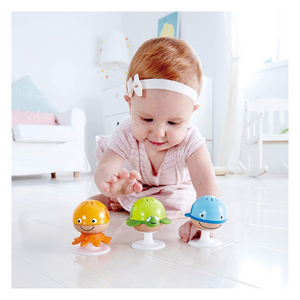 Baby playing with Stay-Put Rattle Set