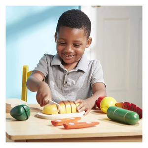 Child playing with Cutting Food Set