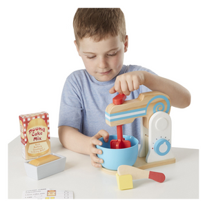 Child playing with Make a Cake Mixer