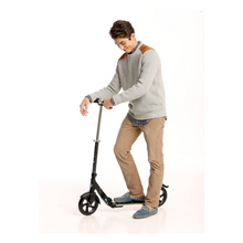 Load image into Gallery viewer, person riding mico flex scooter